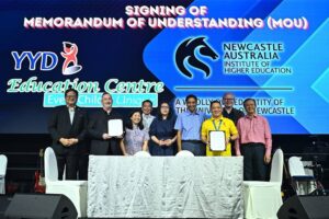 the signing of a Memorandum of Understanding (MOU) between Associate Professor Peter Duffy from Newcastle Australia Institute of Higher Education and Joel Tan from YYD Education Centre